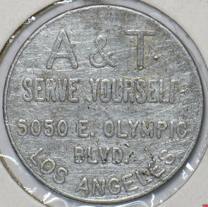 1930 Good for $1 in trade gasoline only Token A&T serve yourself 5050 E. Olympi