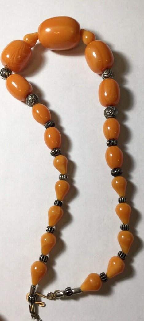 VINTAGE BUTTERSCOTCH AMBER, a fine worry bead necklace composed of thirty  eight beads with silver filigree spacers, tot weight 80 grams.